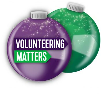 The Volunteering Matters logo on top of a purple Christmas decoration