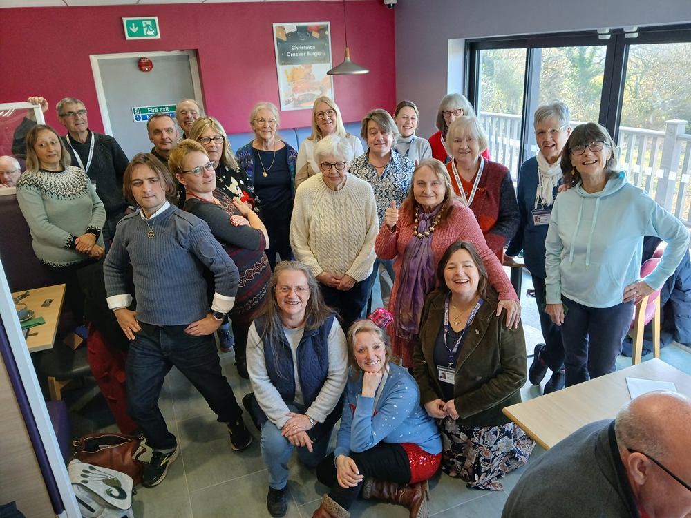 A group of volunteers at PIVOT inside a building