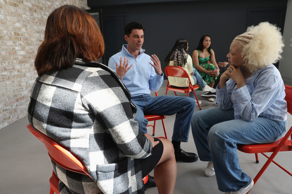 A diverse group talking about health and wellbeing