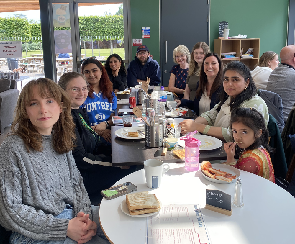 Group of mentors and families inside having lunch together