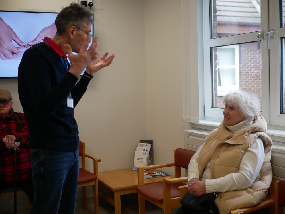 A person speaking to another person