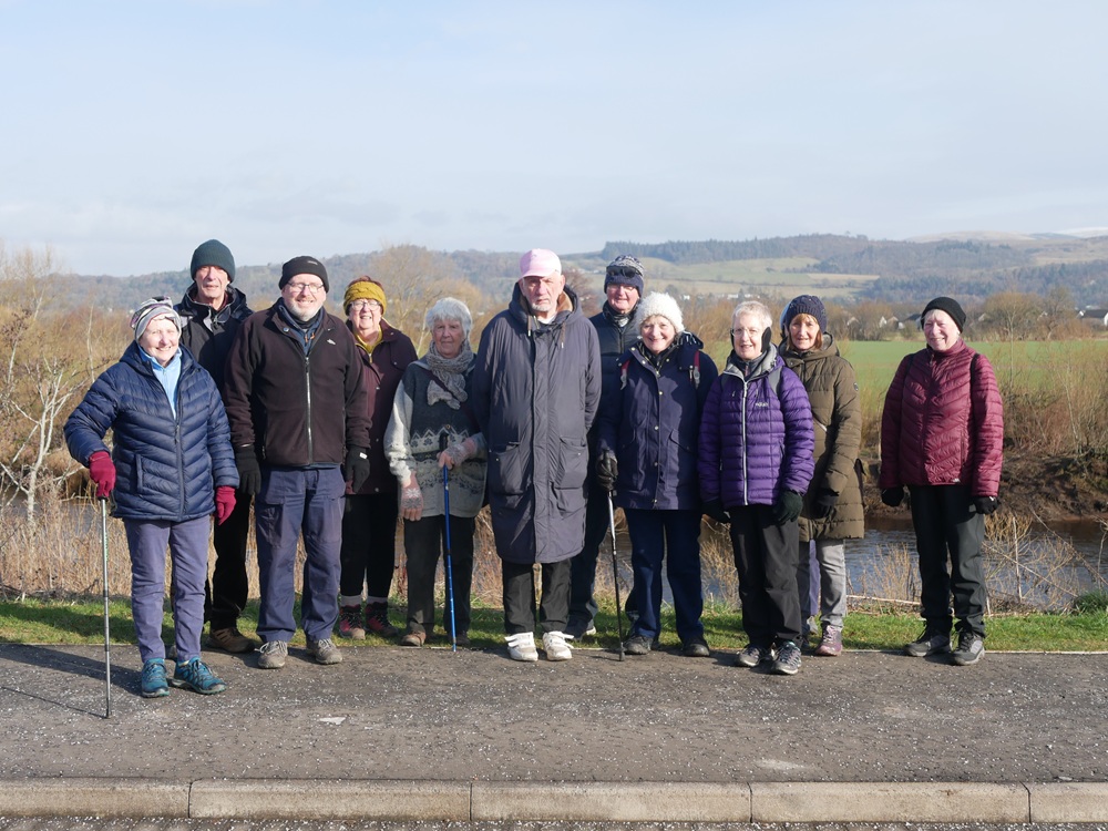 A group of walking standing outside